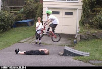 kid jumping over another kid on a bike