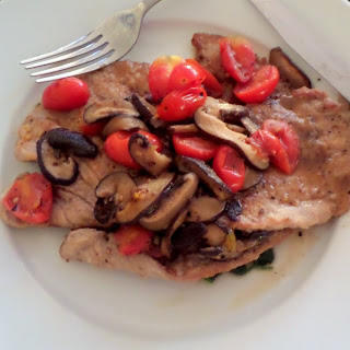 Veal Scallopini:  thin veal cutlets with tomatoes, mushrooms, and spinach in a white wine sauce.