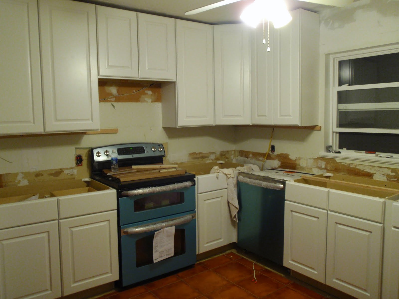 Install crown molding on kitchen cabinets of the cabinets on one side of the room installed