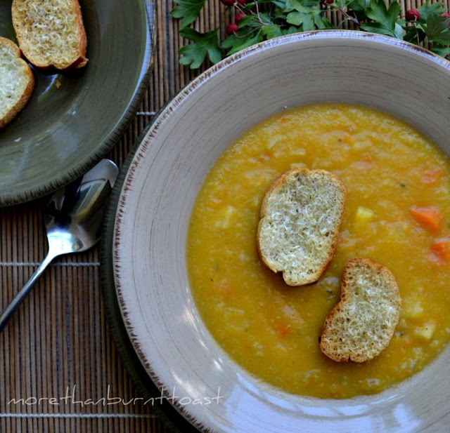 butternut squash chowder with Parmesan toasts on a plate