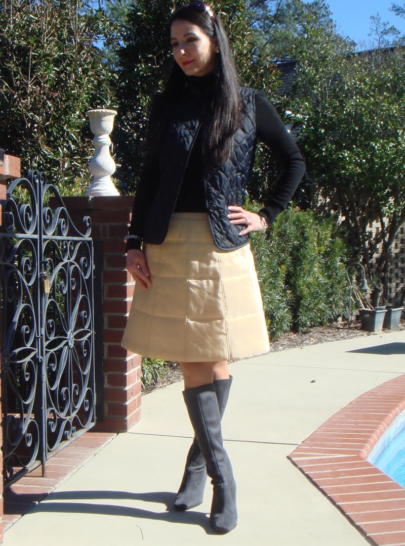 Quilted vest & Quilted Skirt Wearing a quilted vest, black long sleeve turtleneck, quilted gold skirt and knee high grey suede boots.
