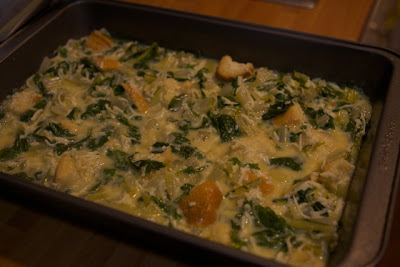 The casserole in a nine by thirteen baking pan.