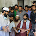Yasin Malik consoling cloudburst victims.