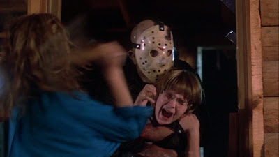 Jason Voorhees (Ted White) grabs Tommy Jarvis (Corey Feldman) in Friday the 13th: Part IV