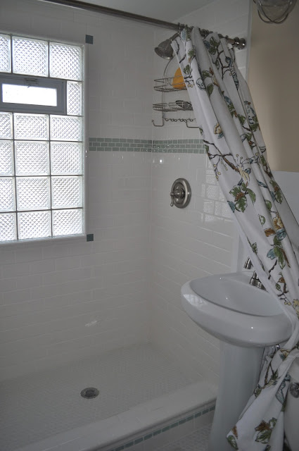 bathroom, reno, subway tile, sea glass tile, glass tile, white grout, grout, glass block window, hex tile