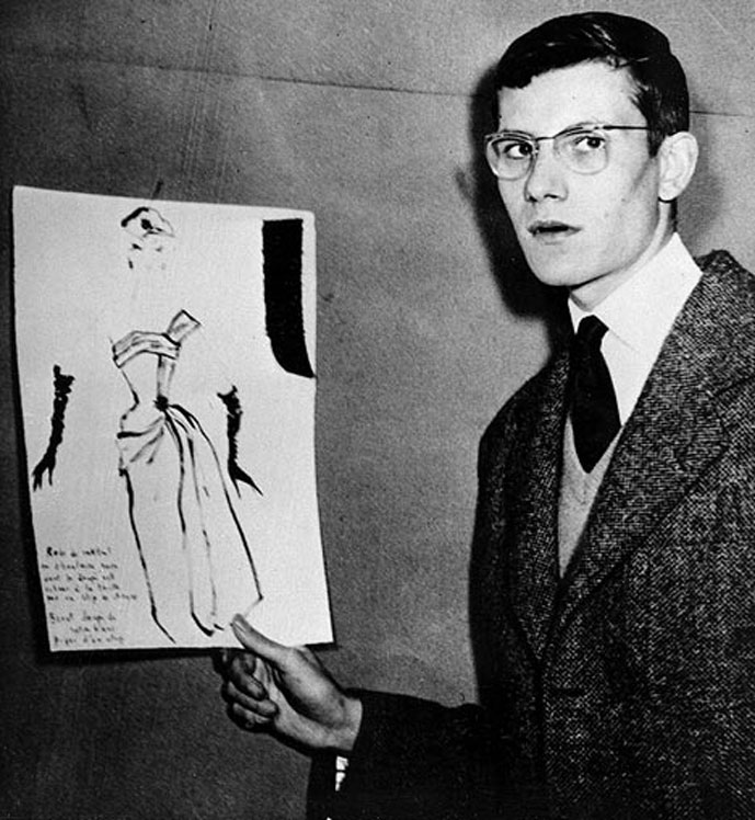 Yves Saint Laurent holding a sketch on 11 December 1954 Yves Saint Laurent holding a sketch on 11 December 1954