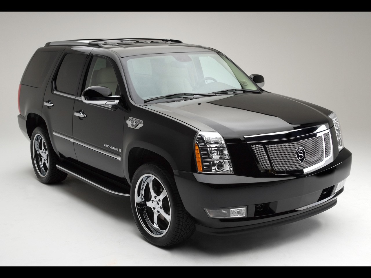 http://4.bp.blogspot.com/-illL4STDCyM/TaCTxzOy9uI/AAAAAAAAApM/R1VaOgXwc_8/s1600/Cadillac_Escalade_black.jpg