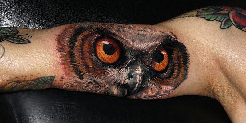 3D Owl head tattoo on arm 