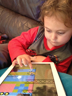 Ben busy playing Toca Robot Lab Toca Robot Lab iPhone / iPad App