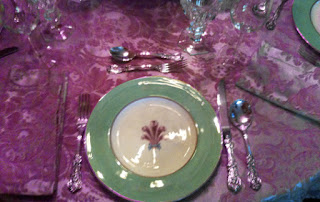 Placesetting Pink table clots with green and white china dishes