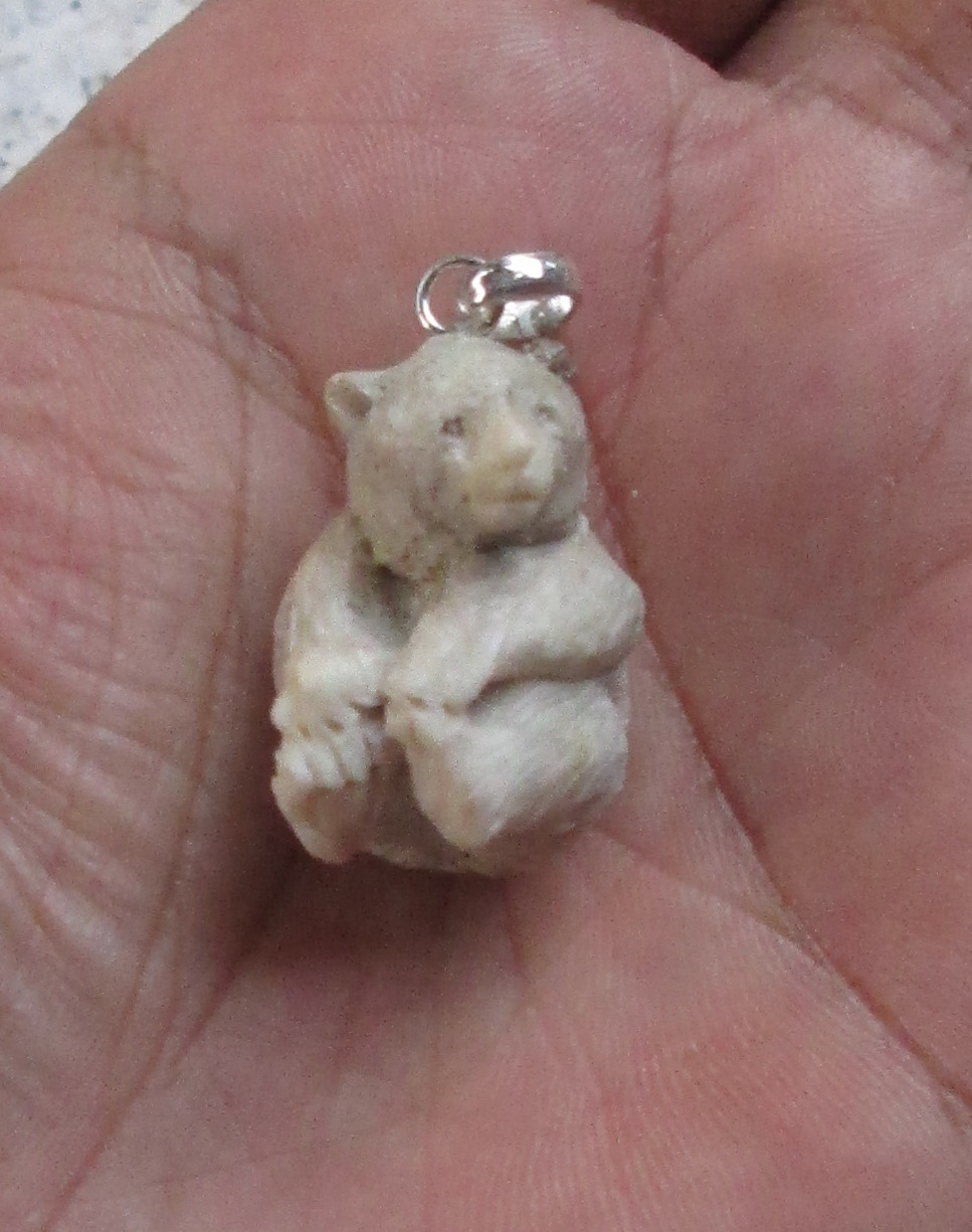 Carved Bear Bone Pendants in Antler Carved Bear Bone Pendants in Antler