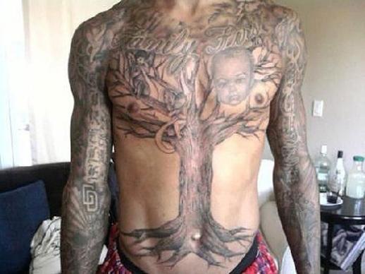 trey songz tattoos on his chest. a tree tattoo on his chest