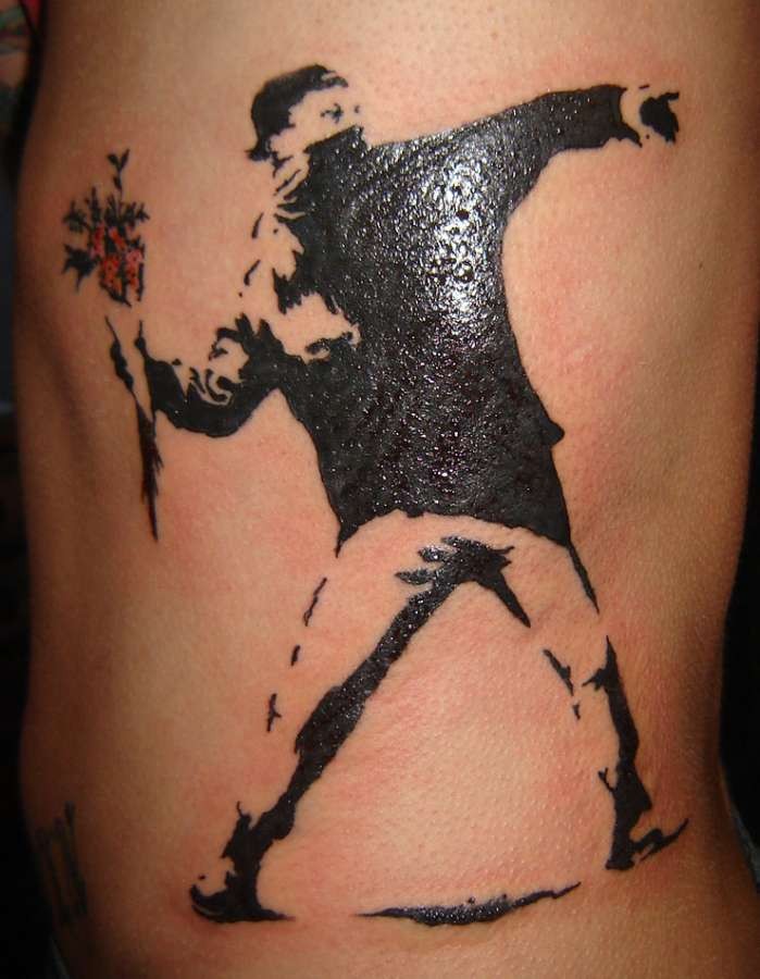 Banksy designs work well with the limitations of tattoo art being clear and