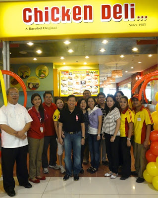 In the middle CHICKEN DELI Founder Roseller Ciocon with family, friends and staff at the branch opening in SM Santa Rosa, Laguna. CHICKEN DELI is now in SM Santa Rosa