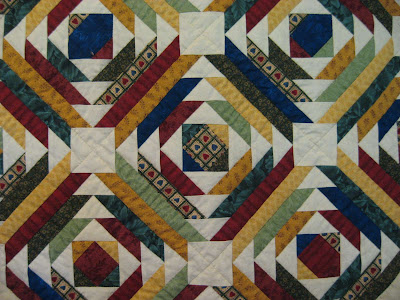 Sarah's hand pieced and hand quilted quilt