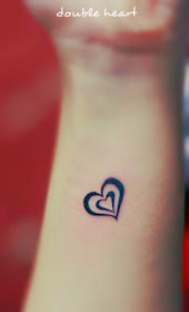 double heart tattoo design with the smaller heart inside the big one