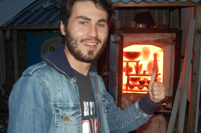 Metin Erturk opening the kiln 