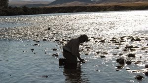 kneeling fisherman