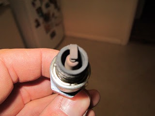 Spark plug after 30 miles on 60 km roads city traffic - spark plug reading two stroke