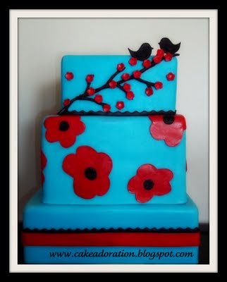 Blue and Red Modern Cherry Blossom Cake with two little love Birds on top Blue and Red Modern Cherry Blossom Cake with two little love Birds on top