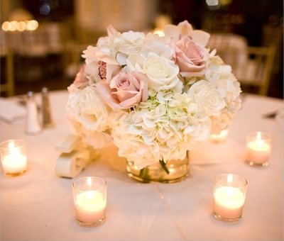 The Beauty Of A Beach Wedding Is That You Can Go As Simple Like With Your Tables Pink And White Centerpiece On Light Tan Tablecloth Fits The Beauty Of A Beach Wedding Is That You Can Go As Simple Like With Your Tables Pink And White Centerpiece On Light Tan Tablecloth Fits