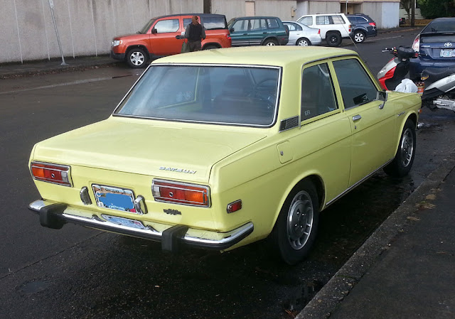 Rear of a Datsun 510 coupe.