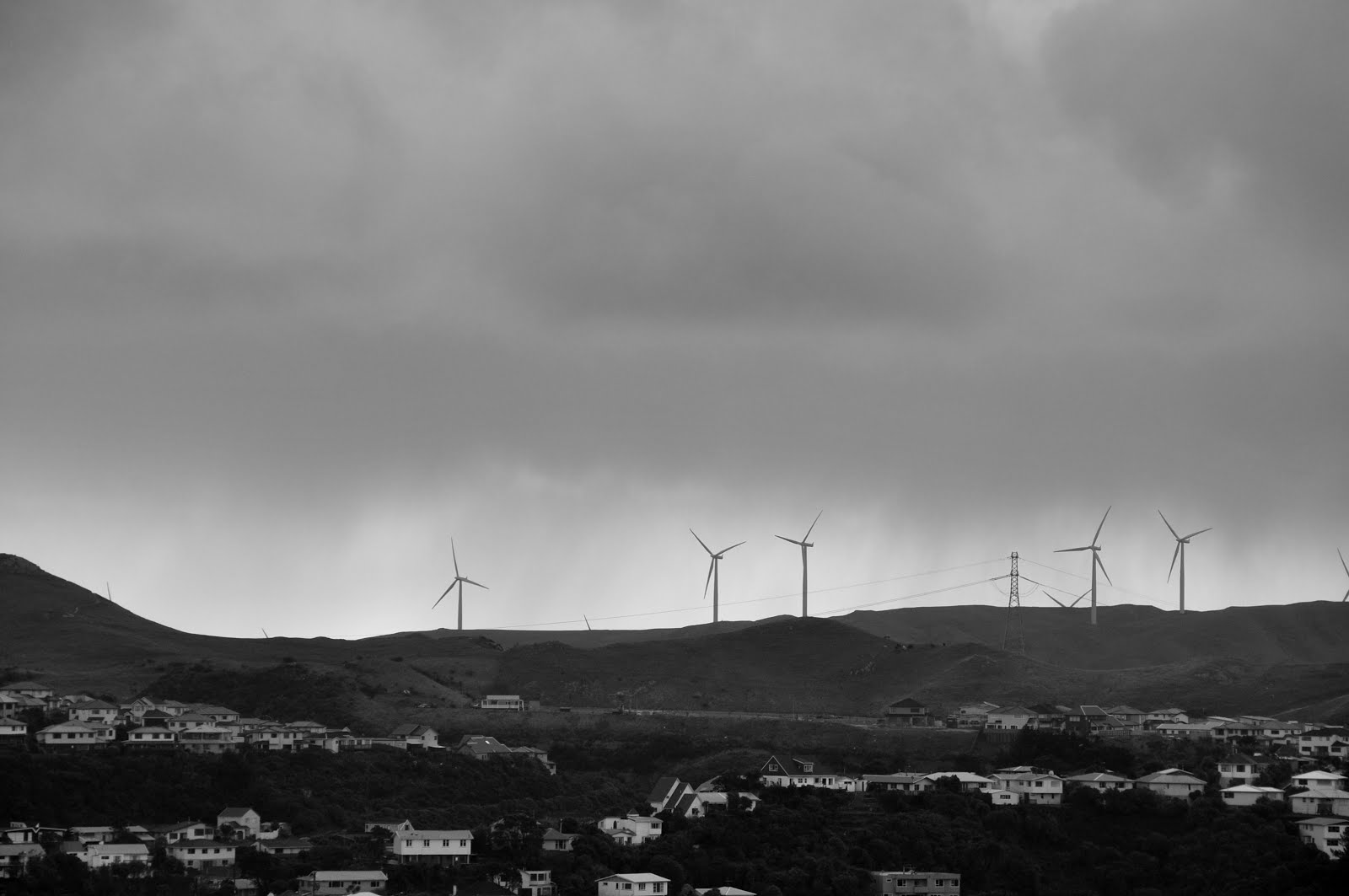 Looking west to spinning wind turbines on a cold grey afternoon