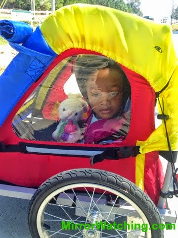 toddler in bike trailer