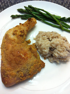 Hummus (humus) crusted chicken baked in the oven along side risotto and asparagus