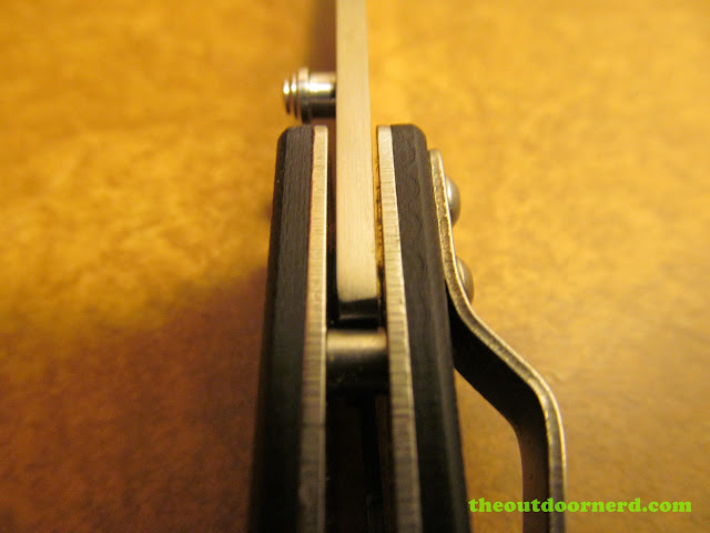 Sanrenmu 704 Folding Pocket Knife showing closeup of spine Sanrenmu 704 Folding Pocket Knife showing closeup of spine