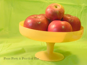 A cake plate used as an apple display bowl 