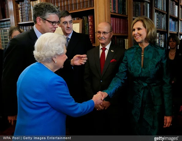 Queen Elizabeth II greets Lynn Forney Young, President of the Daughters of the American Revolution while attending the launch of the George III Project at an event held in the Royal Library in Windsor Castle