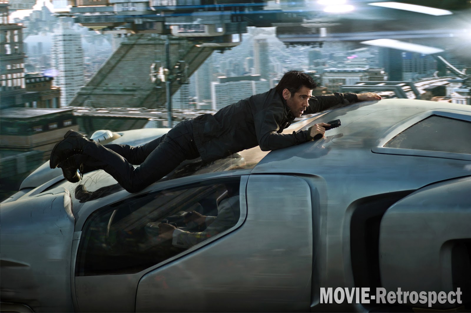 Colin Farrell clings to the front of a flying car Minority Report style in Total Recall