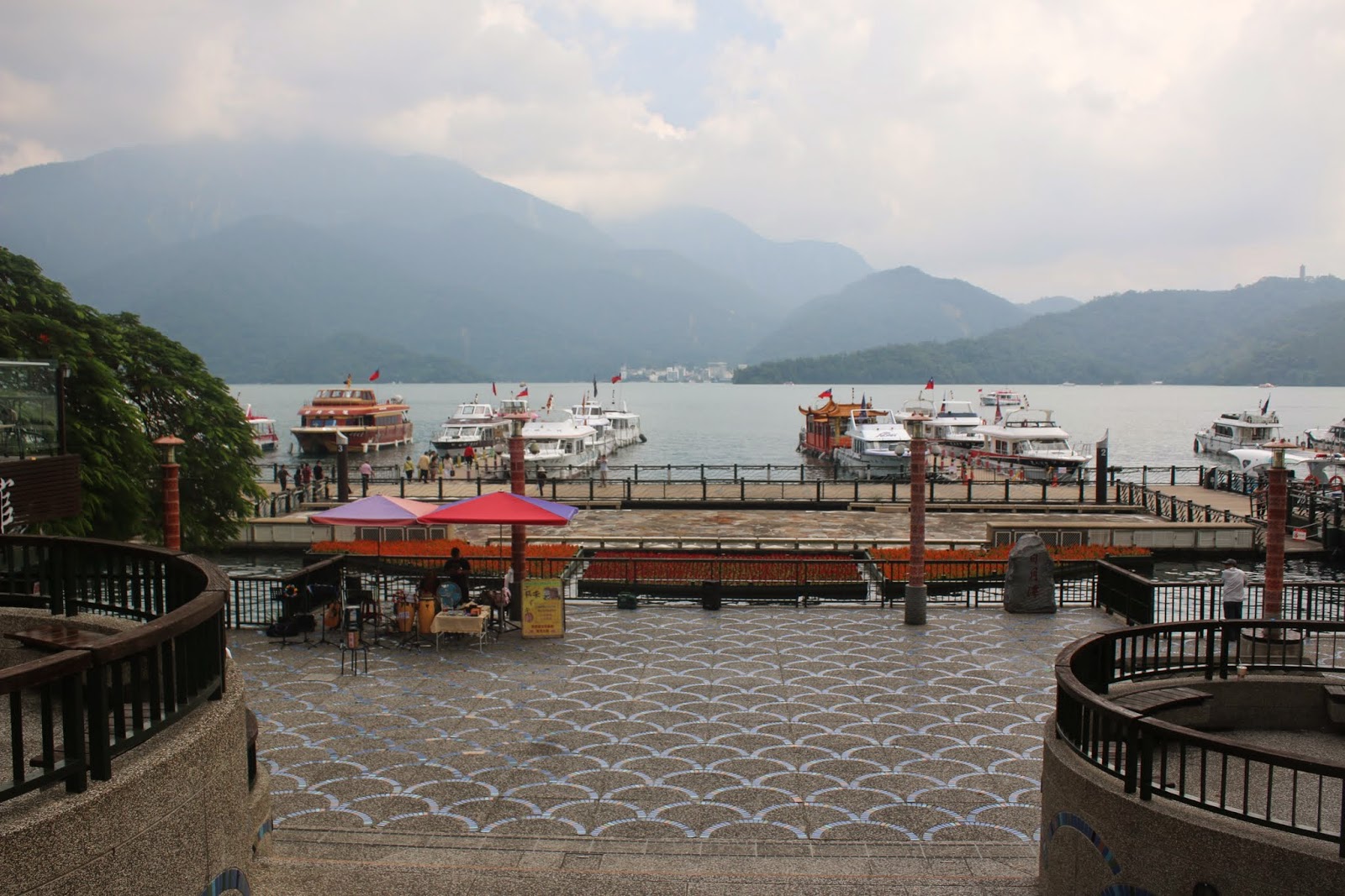 A close look at beautiful Sun Moon Lake and the greenery mountain from Shueishe Pier of Nantou County in Taiwan A close look at beautiful Sun Moon Lake and the greenery mountain from Shueishe Pier of Nantou County in Taiwan