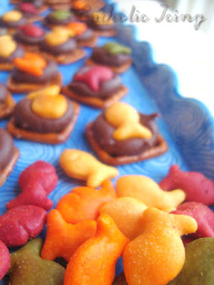 Rainbow Goldfish on pretzels with chocolate