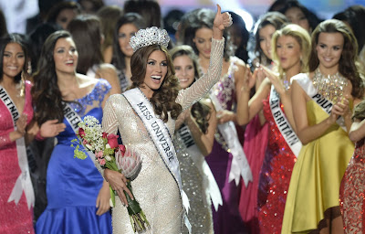 Miss Venezuela Gabriela Isler (C) celebrates with her crown during the 2013 Miss Universe competition in Moscow on November 9, 2013. A 25-year-old Venezuelan television presenter, Gabriela Isler, was crowned Miss Universe in Moscow in a glittering ceremony. Judges including rock star Steven Tyler from Aerosmith picked the winner from a total of 86 contestants at the show, watched by several billion viewers around the world