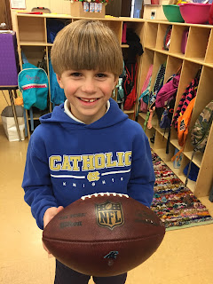 Holy Spirit Campus First Grader Shares A Tall Tale and Game Ball for Show & Tell 1