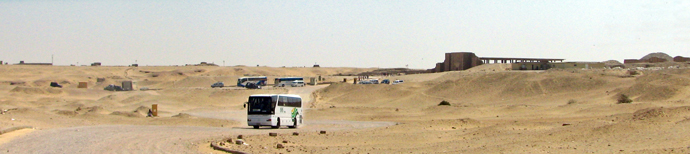 A pyramid appears in the distance. A pyramid appears in the distance.