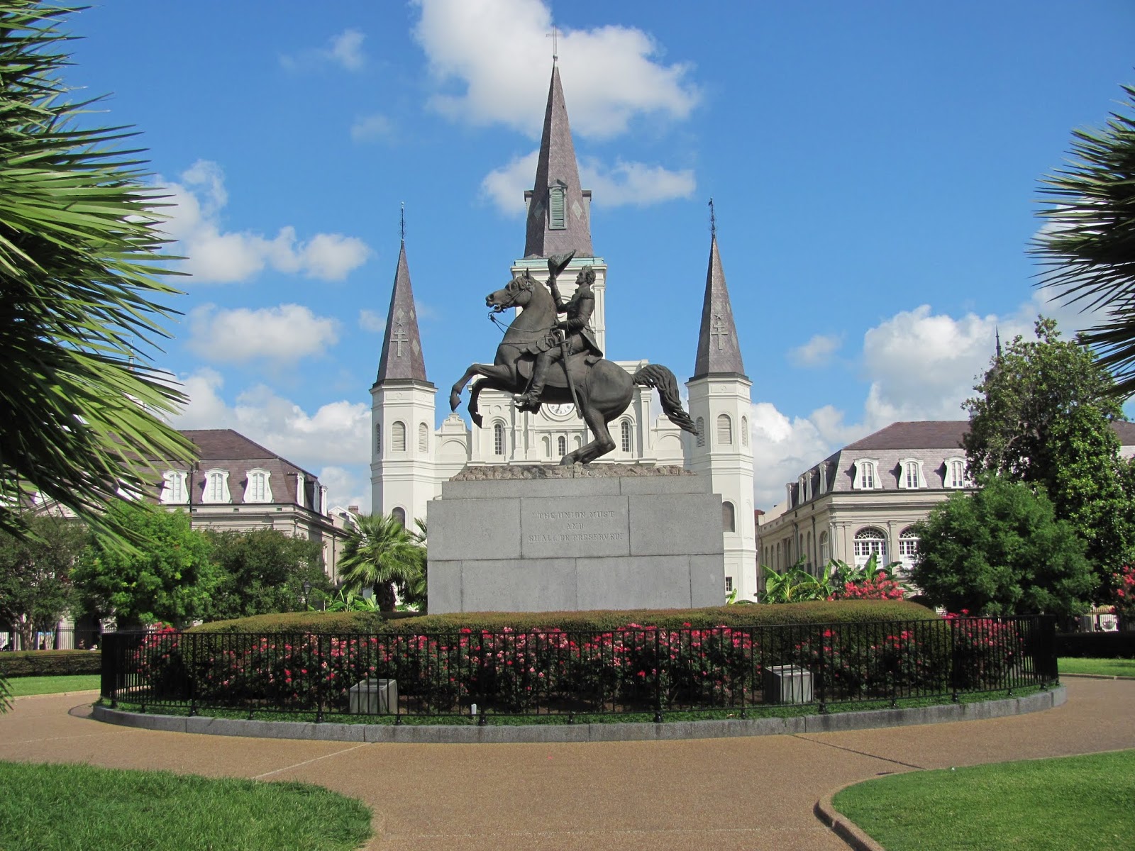 Jackson Square in New Orleans, LA Andrew Jackson equestrian statue in a park with a church in the background