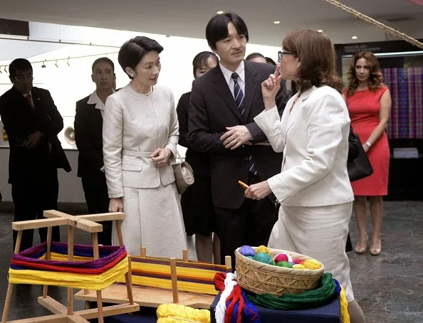Japan's Prince Akishino (C) and his wife Princess Kiko (L) listen to expert Barbara de Arathoon during a visit to the Popol Vuh Museum in Guatemala City