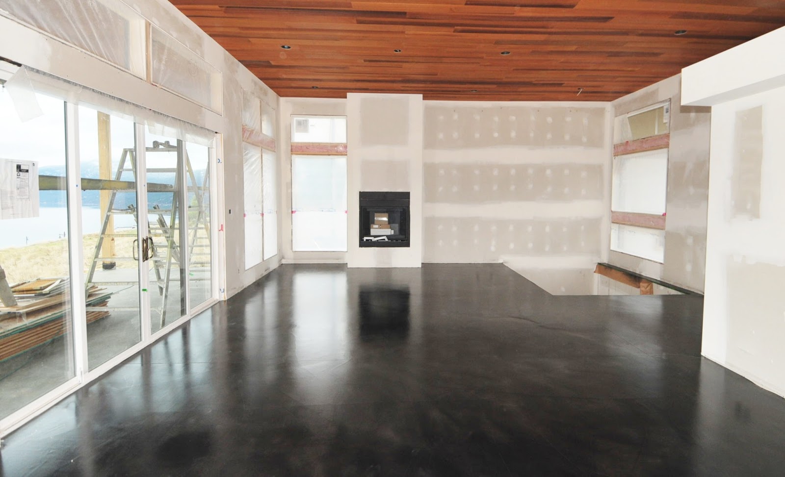 MODE CONCRETE: Black Acid Stained Modern Concrete Floor - created in