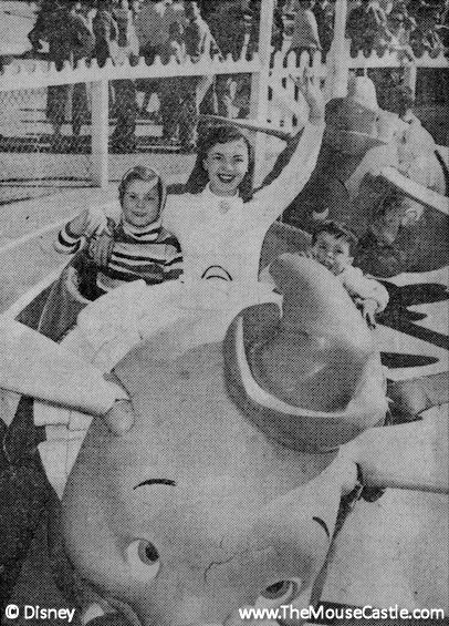 Shirley Temple and her children ride Dumbo at Disneyland, March 1956