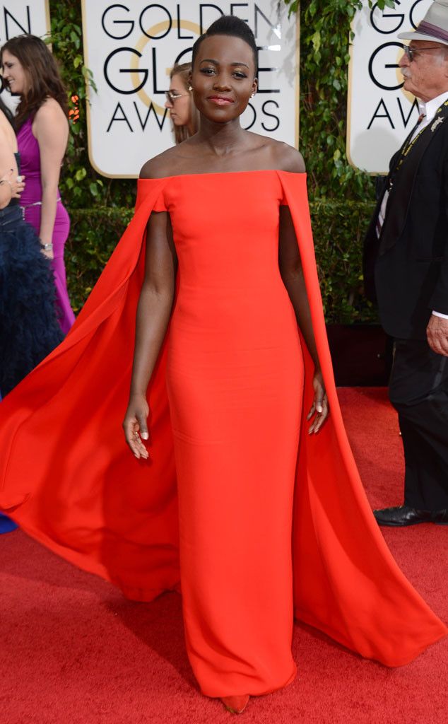 Lupita Nyong'o in a red Ralph Laurent gown with cape at the 2014 Golden Globe Awards