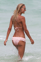 Petra Benova in a tiny bikini getting into the ocean