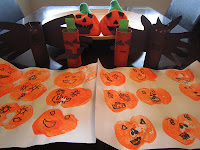 Halloween crafts: Cut apples in half & stamp with paint for "pumpkin" placemats; paint toilet rolls orange and black, trace & cut out hand prints for bat wings, paste construction paper ears & fangs for bats, eyes & mouth for pumpkins, glue on googly eyes. kids' crafts