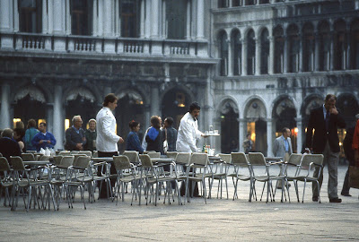 two waiters serving coffee in Piazza San Marco.