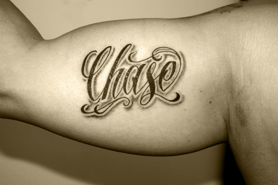 letter tattoos. lettering tattoos on ribs.