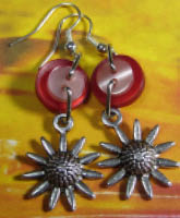 Cheeky Charm Earrings Flower charm fun earrings have silver sunflower charms hanging from layered red and pink buttons