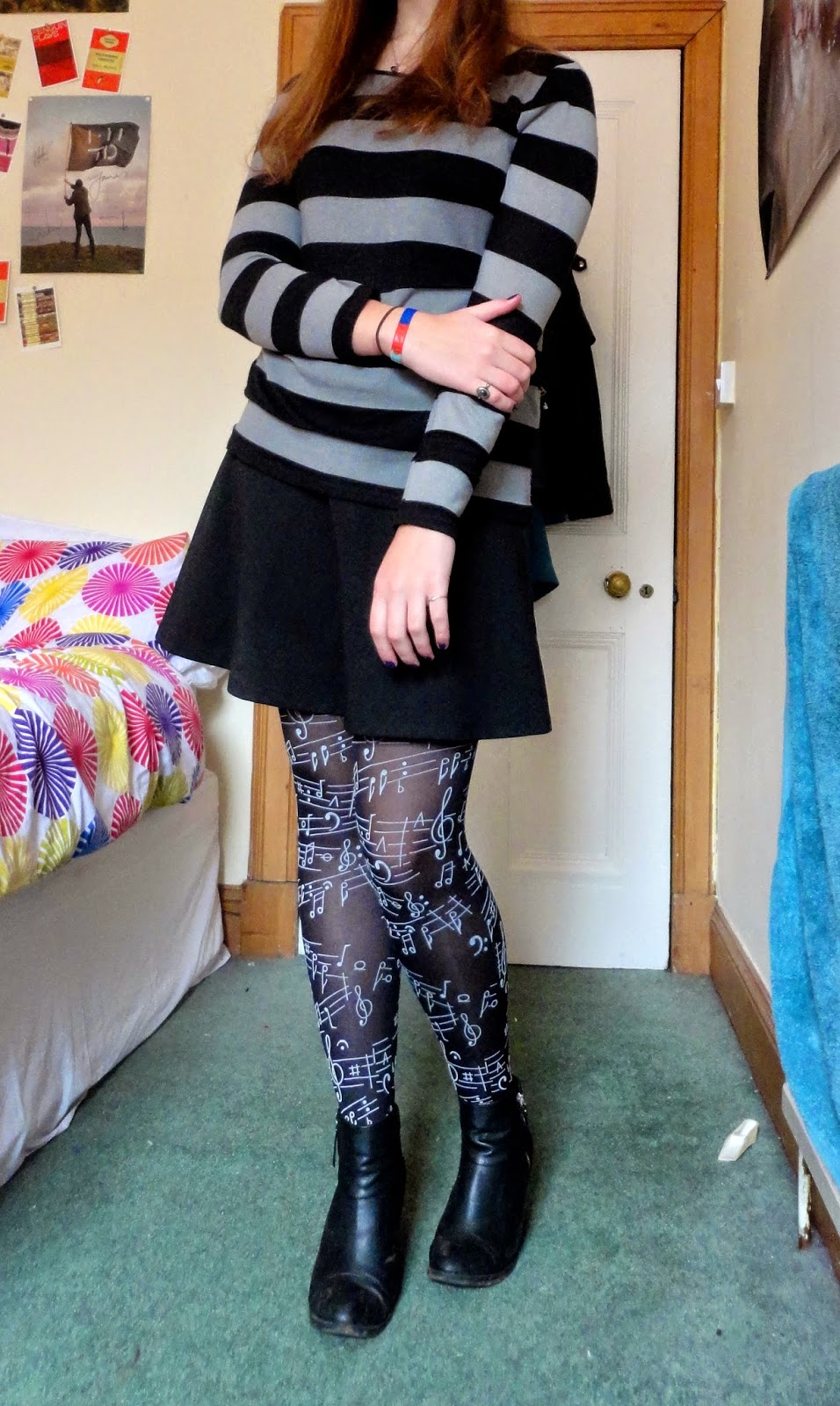 outfit of striped jumper, black skirt and musical tights