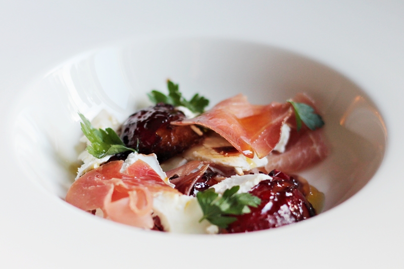 Delicious Tapas Parma ham with balsamic vinegar glazed plums & goat